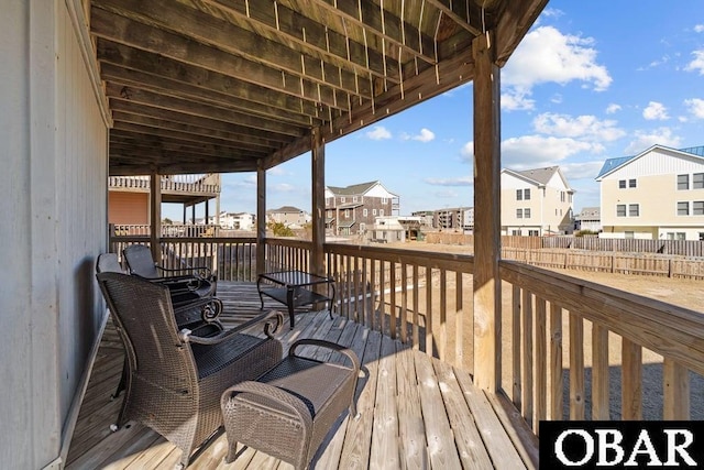 wooden terrace with a residential view