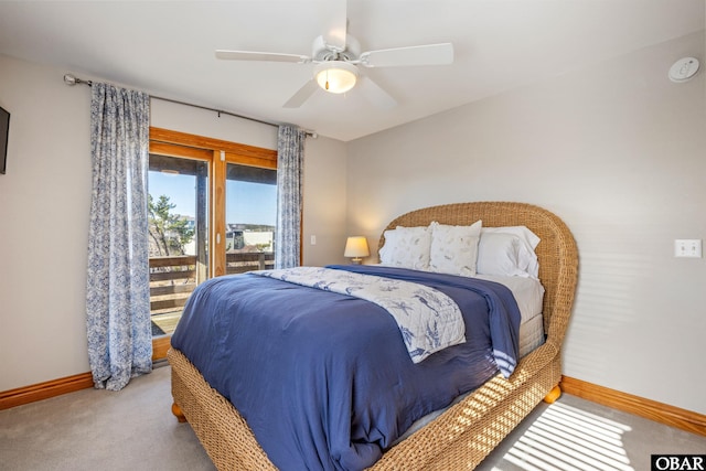 carpeted bedroom with access to outside, a ceiling fan, and baseboards