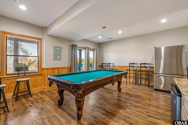 playroom with recessed lighting, a wainscoted wall, and wood finished floors