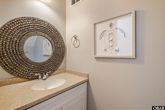 bathroom featuring vanity and visible vents