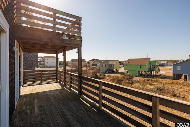 deck with a residential view and a pergola