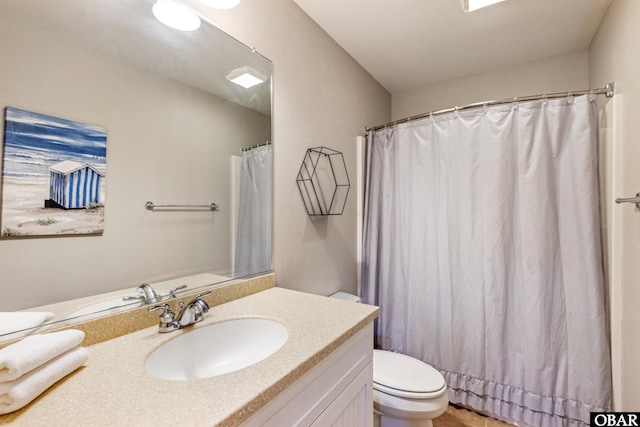 bathroom featuring toilet and vanity