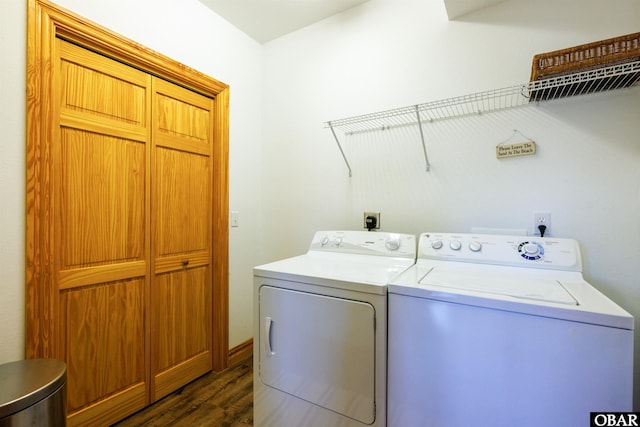 laundry area with laundry area, dark wood-style flooring, and washing machine and dryer