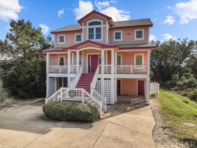 view of front facade with covered porch and stairway