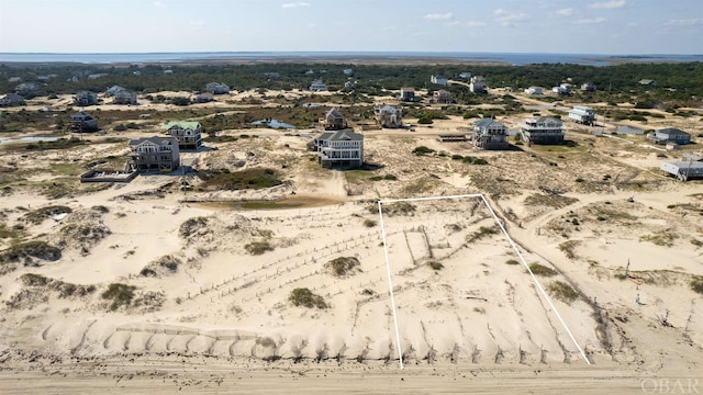 birds eye view of property with a desert view