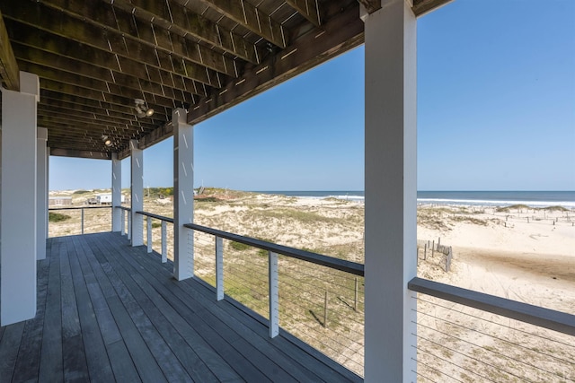 deck featuring a water view and a view of the beach