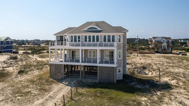 rear view of house featuring a balcony