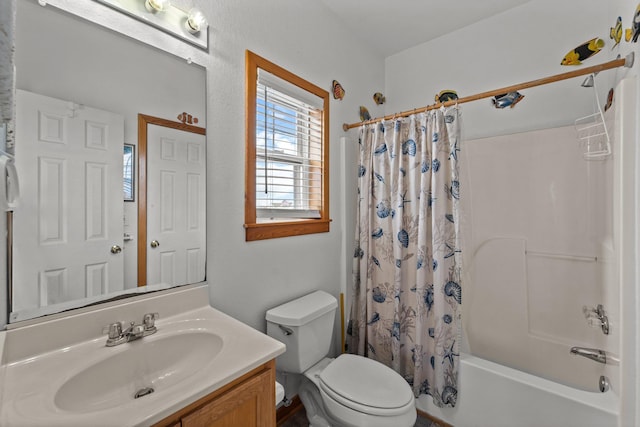bathroom featuring vanity, toilet, and shower / tub combo