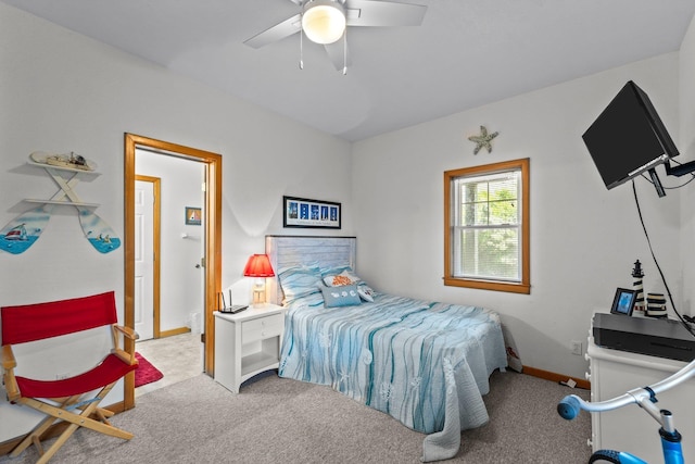 carpeted bedroom with baseboards and a ceiling fan