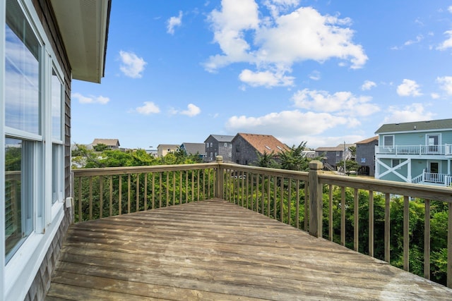 wooden deck featuring a residential view