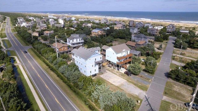 birds eye view of property with a water view and a residential view