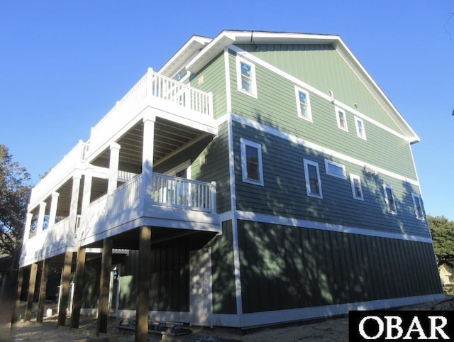 back of house with a balcony