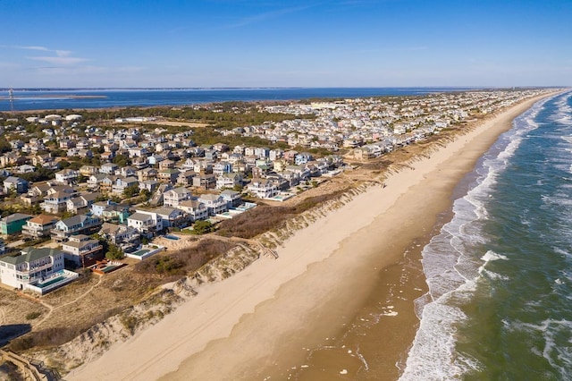 birds eye view of property featuring a residential view, a view of the beach, and a water view