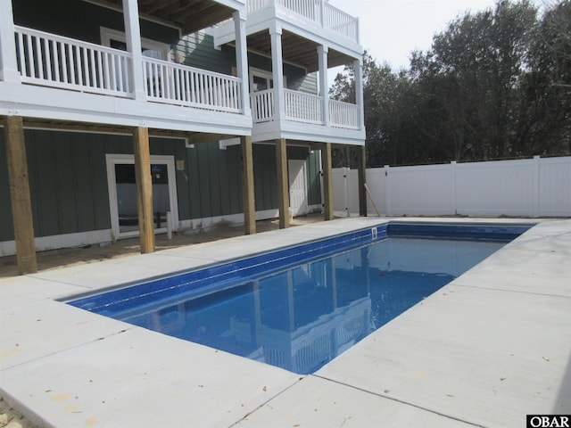 view of swimming pool featuring a patio area, a fenced backyard, and a fenced in pool