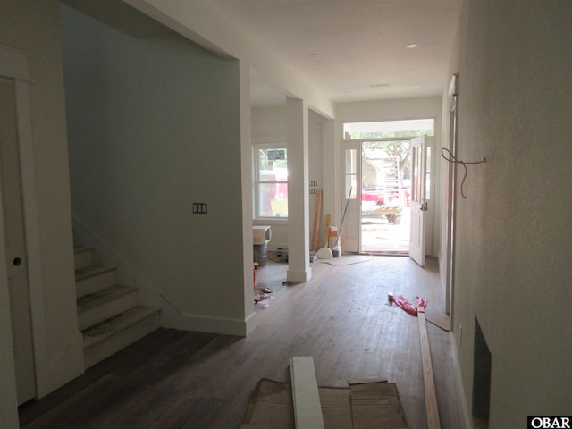 entrance foyer with stairs and wood finished floors