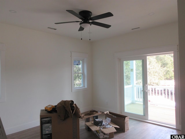 dining area featuring visible vents, baseboards, and wood finished floors