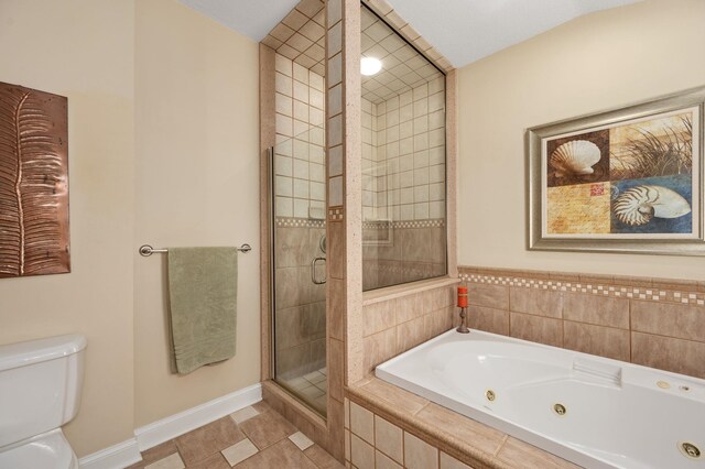 bathroom featuring toilet, a stall shower, tile patterned flooring, a jetted tub, and baseboards