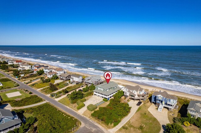 bird's eye view with a water view, a residential view, and a view of the beach