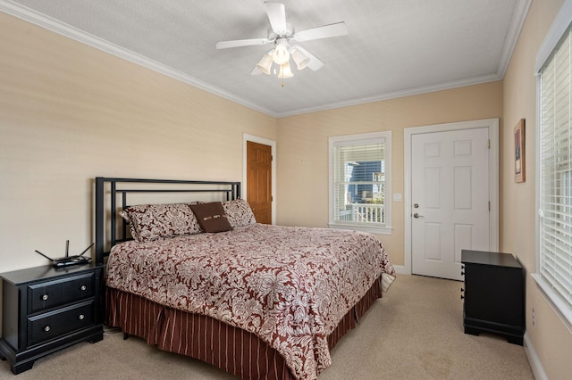 bedroom featuring baseboards, ornamental molding, a ceiling fan, and light colored carpet