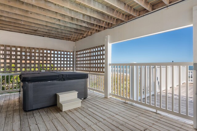 deck featuring a hot tub