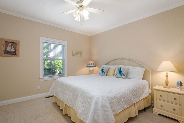 bedroom with baseboards, crown molding, a ceiling fan, and light colored carpet