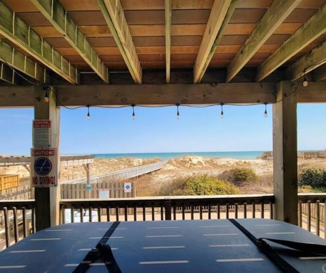 wooden deck with a water view