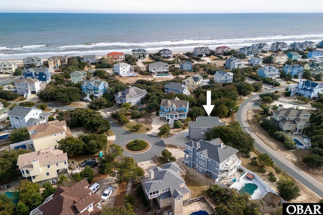 drone / aerial view featuring a water view and a residential view