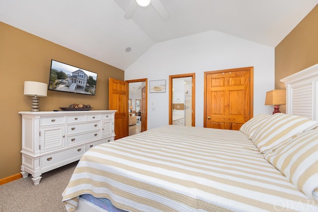 bedroom featuring lofted ceiling, connected bathroom, light colored carpet, a ceiling fan, and baseboards