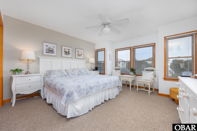 bedroom featuring ceiling fan, carpet floors, and baseboards