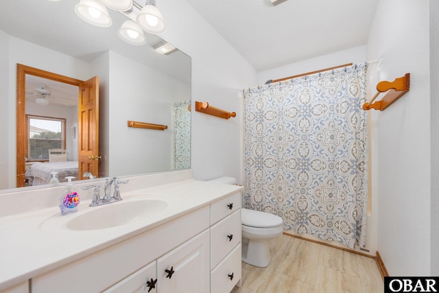 ensuite bathroom with toilet, vanity, and ensuite bathroom