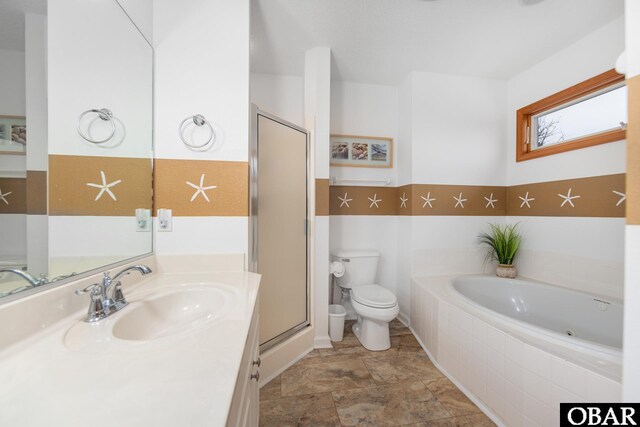 bathroom featuring toilet, a stall shower, a bath, and vanity