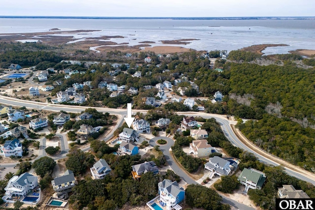 bird's eye view featuring a residential view and a water view