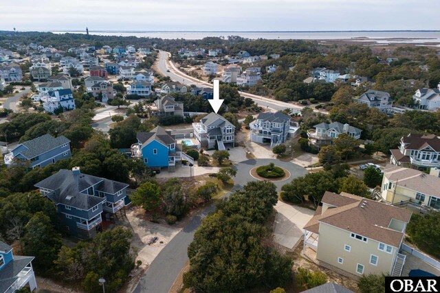 aerial view with a residential view and a water view