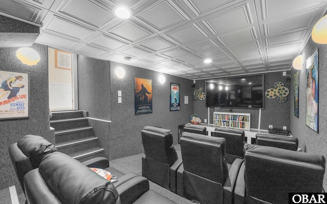 home theater room featuring an ornate ceiling