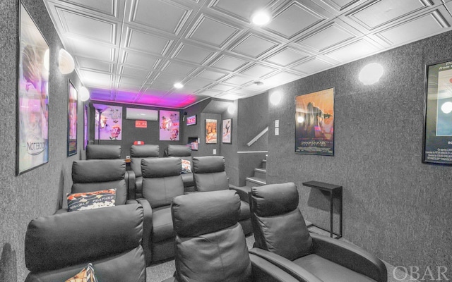 home theater room with an ornate ceiling and an AC wall unit