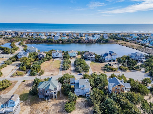 bird's eye view featuring a water view and a residential view