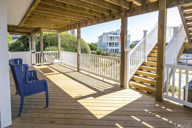 wooden terrace featuring stairway