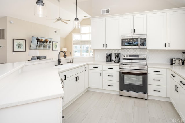 kitchen featuring white cabinetry, visible vents, appliances with stainless steel finishes, and a sink