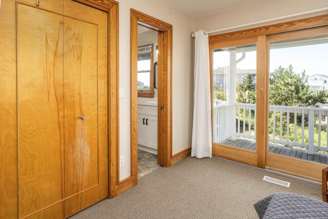 1229 Ocean Hill Ct Lot 120, Corolla, NC 27927 - doorway to outside with light carpet and baseboards