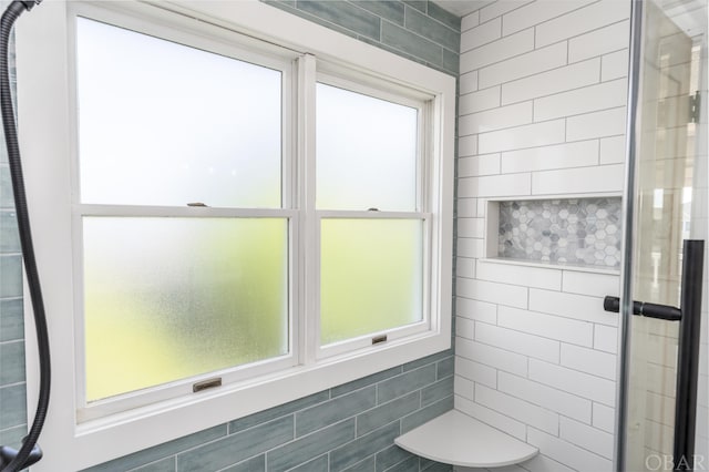 full bathroom with a tile shower