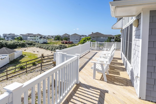 wooden deck featuring a residential view