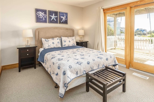 bedroom with access to exterior, light colored carpet, visible vents, and baseboards