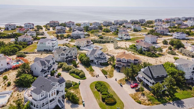 bird's eye view featuring a residential view and a water view