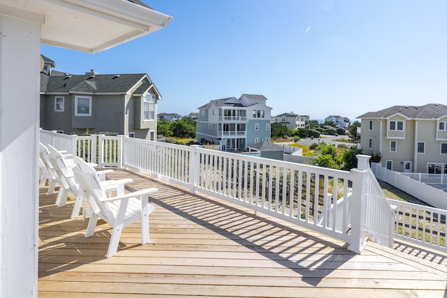 wooden deck with a residential view