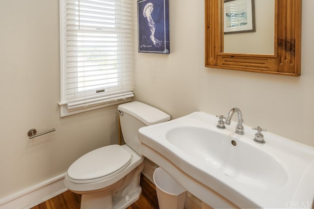 half bathroom with a sink and toilet