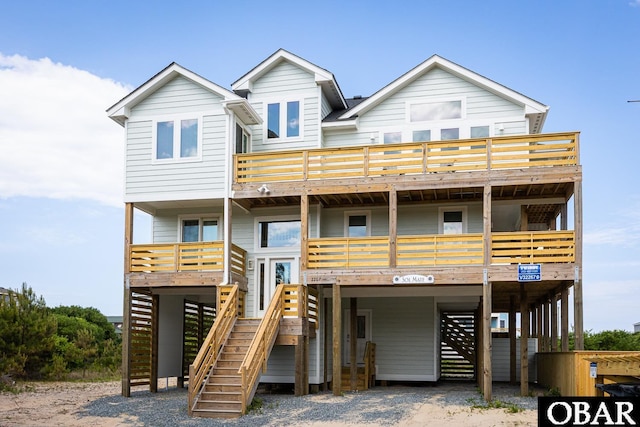 2267 Sandpiper Rd Lot 29, Corolla, NC 27927 - raised beach house with a carport, stairway, a balcony, and driveway