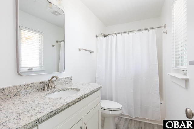 2267 Sandpiper Rd Lot 29, Corolla, NC 27927 - bathroom with vanity, toilet, wood finished floors, and shower / tub combo