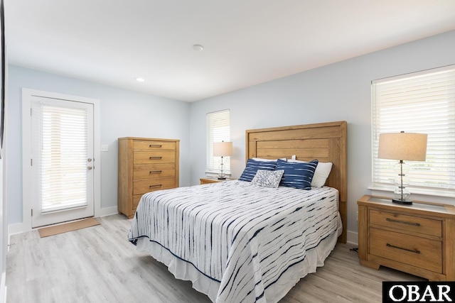 2267 Sandpiper Rd Lot 29, Corolla, NC 27927 - bedroom featuring light wood-type flooring, multiple windows, access to outside, and recessed lighting
