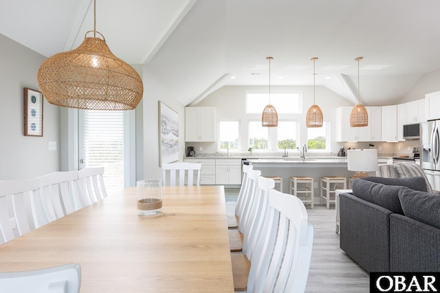 2267 Sandpiper Rd Lot 29, Corolla, NC 27927 - dining area featuring vaulted ceiling, light wood-type flooring, and recessed lighting