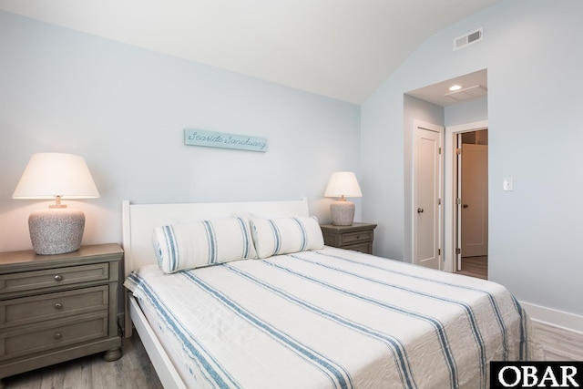 2267 Sandpiper Rd Lot 29, Corolla, NC 27927 - bedroom featuring wood finished floors, vaulted ceiling, and baseboards